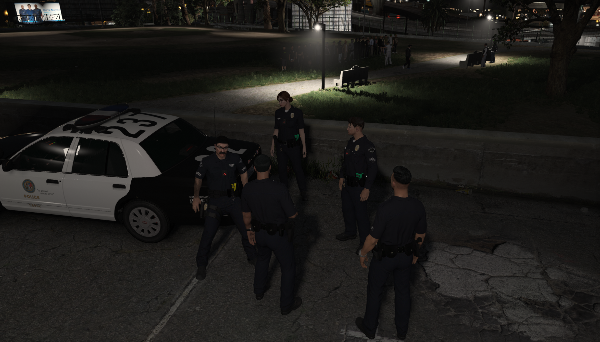 Two Officers at station walking in the hall.